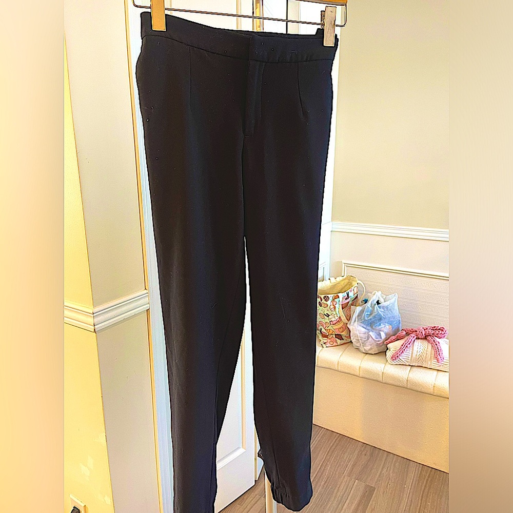 Harvé Benard business casual pants with zipper at bottom of legs.